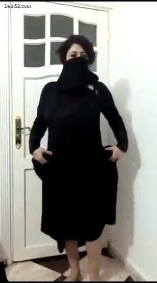 Girl in a hijab dances and strips showing boobs and ass