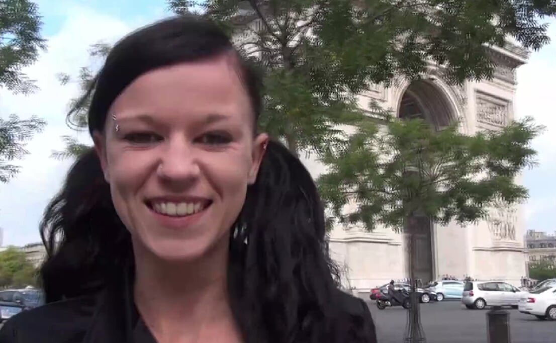 Vanessa , a pretty brunette, shows off on the Champs Elysees
