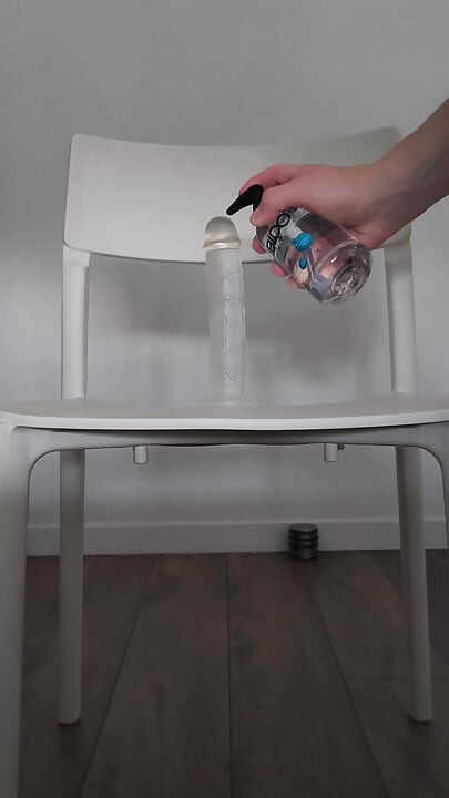 Sexy guy rides his dildo on a chair