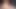 Footjob für Schwanz in orangefarbenem Kondom und 2 Penisringe