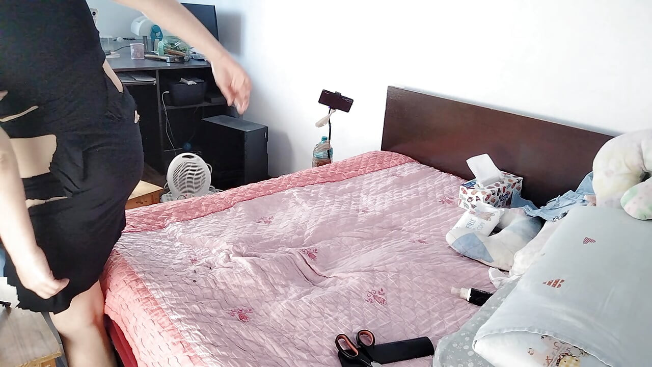 Amateur wife having fun trying on clothes that she cuts. Sexy mom dancing naked in the house.