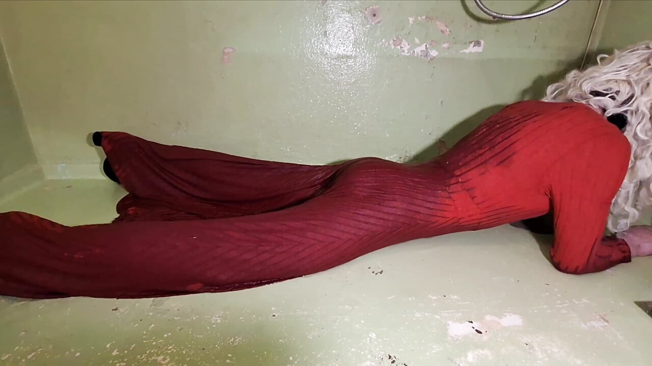 In the shower in a long red dress