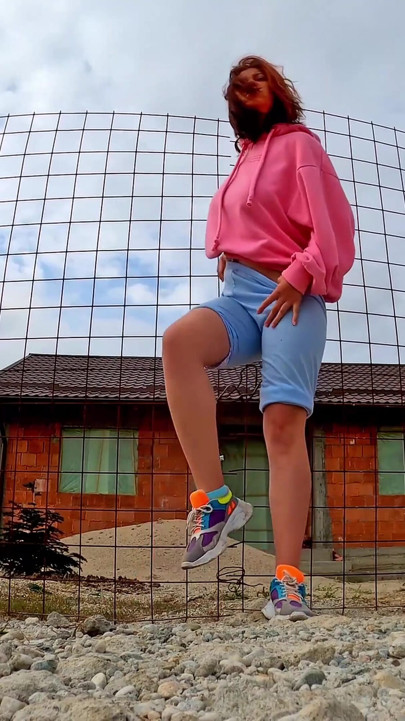 Hipster girl pee in her jeans - changing her wet shorts into dry pants