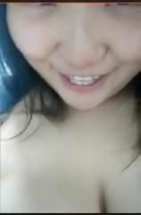 Asian girl shows her boob