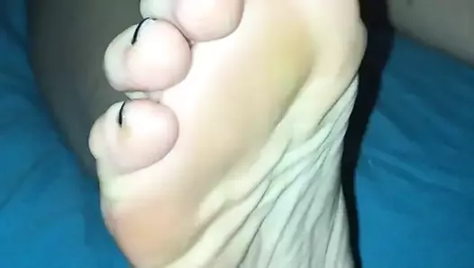 Wife's feet in bed