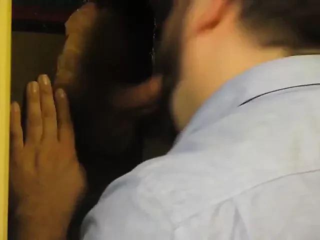 Glory hole cocksucking ends with cum on his beard
