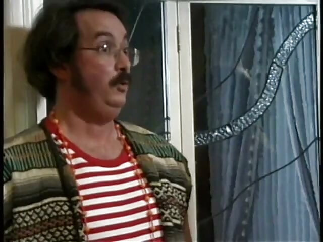 Ron Jeremy organizes orgy with a 70s crossdresser face fucking busty brunette on bed