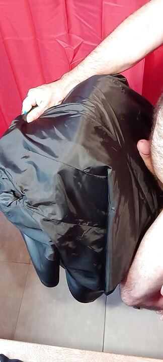 Ejaculating on the lining of her black leather coat