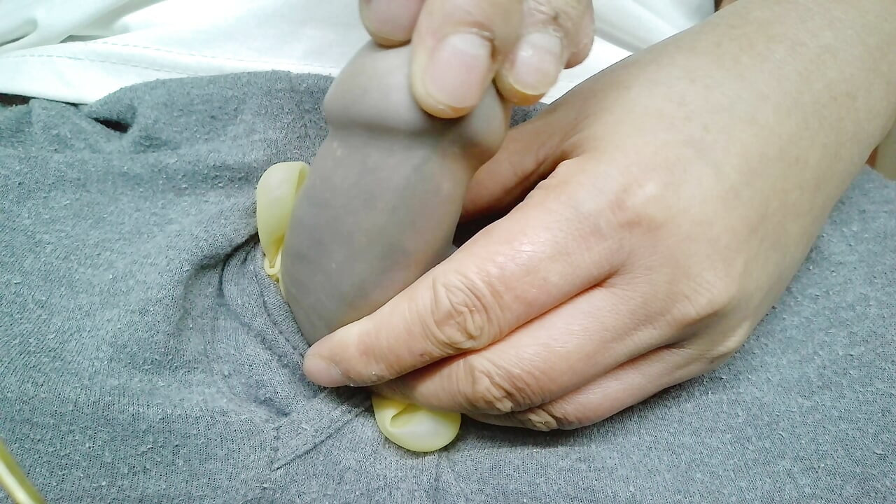 Wearing translucent latex gloves and using a vibrator to achieve multiple orgasms