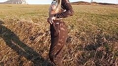 A Girl with a Beautiful Body Poses in a Field