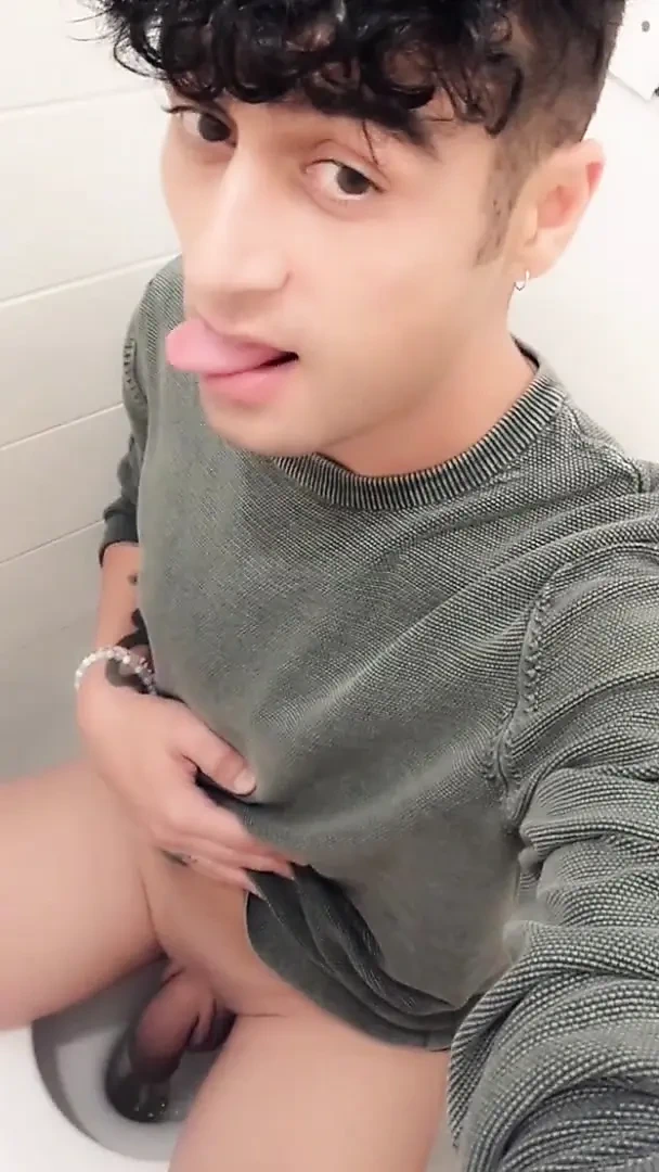 Twink Is Peeing with His Uncut Cock in Sitting Position on a Toilet