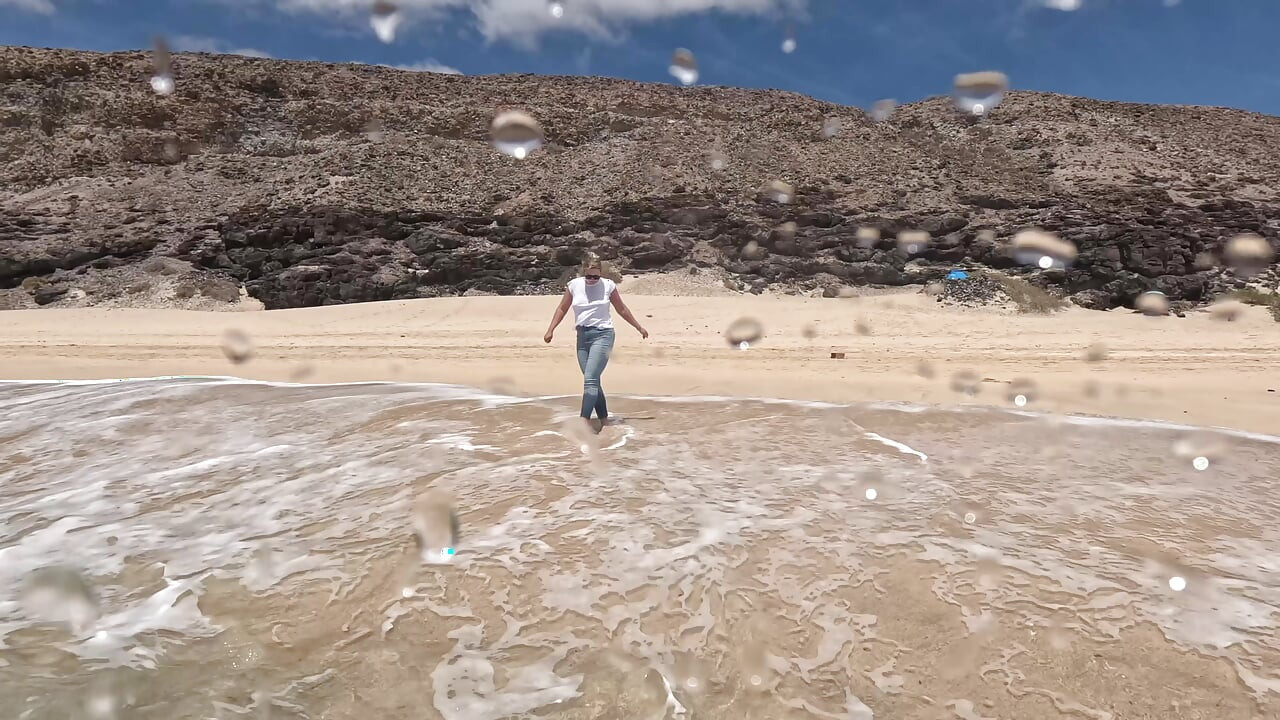 Girl Wetting Jeans in the Ocean and Swimming in Wet White T-shirt