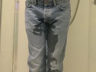 Guy pees in jeans