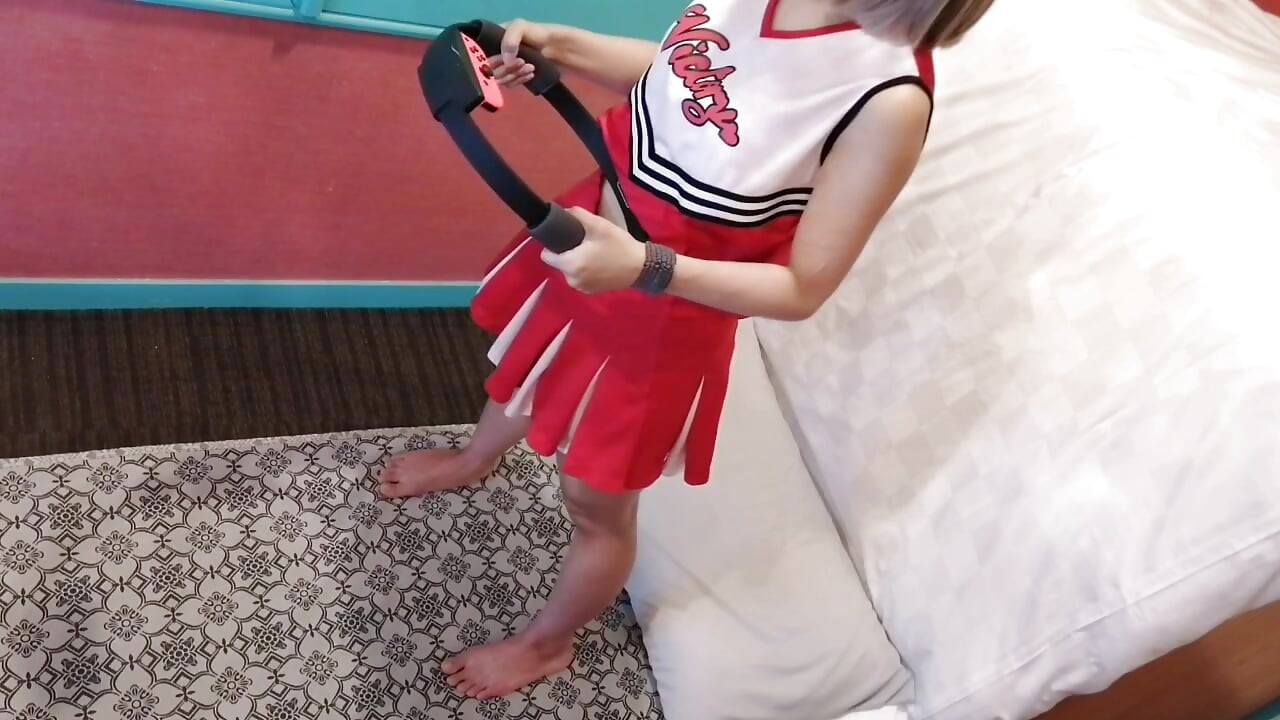 A cute, busty married woman does exercise 3 in a sexy cheerleader costume. Peeking down from above. Home made amateur Private Shoot