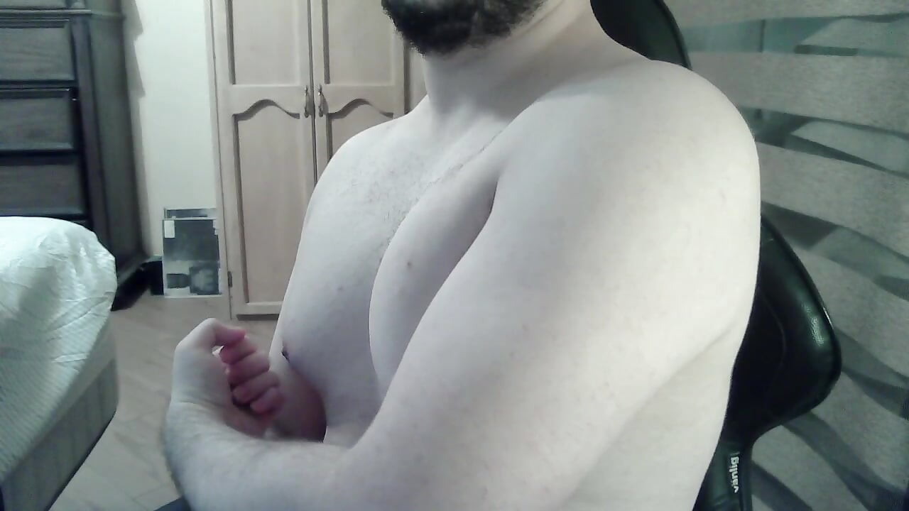 Muscular jock flexes his muscles on can