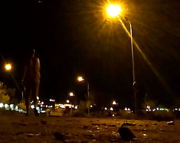 Naked on a quiet street at night