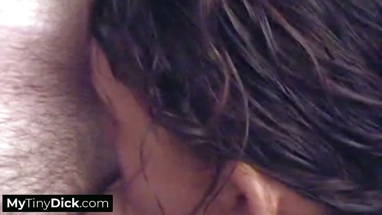 A beauty takes her time sucking his small cock