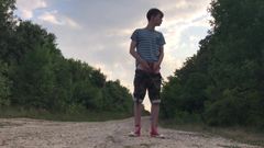 Teenager jerking off on a dusty road