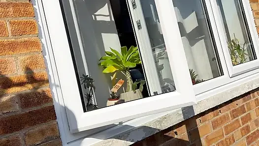 window peeping view of horny housewife