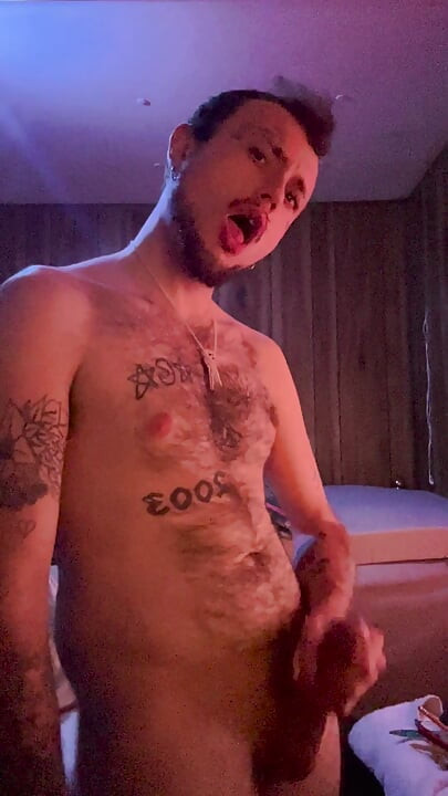 Tattoo stud playing with his cock