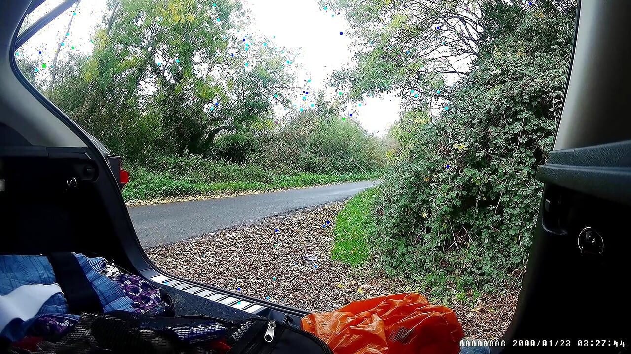 Just getting changed parked at side of road with cars driving past