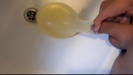 young german twink pissing in condom till its completely full and blown up like a baloon and jerking off after this relief