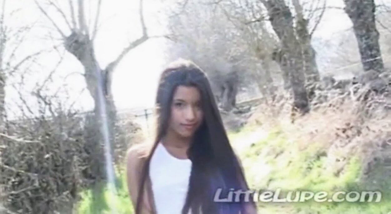 Petite latina masturbates under the sun