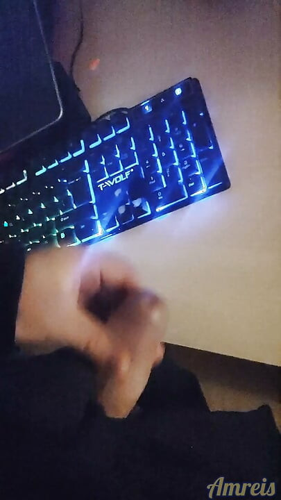 Gamer in the night. Cum on table.