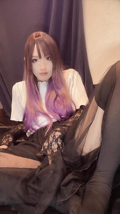 A video of a sexy cross-dresser with purple hair masturbating quietly