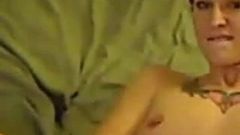 Pierced and tattooed redhead playing with pussy on home cam