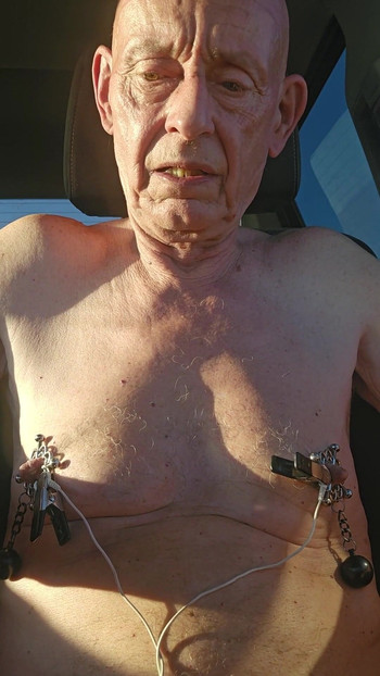 Captivating moment from "nipple torture with spiked clamps and tens unit"