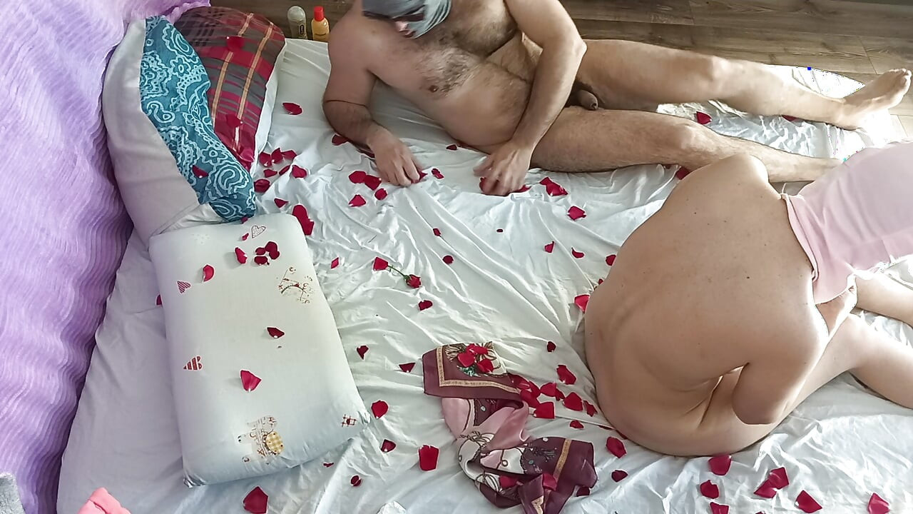 Sensual massage of a hot couple with oil on the body.