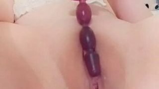 sliding anal beads into my cute innie pussy