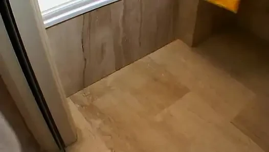 Brunette masturbates in the bathroom