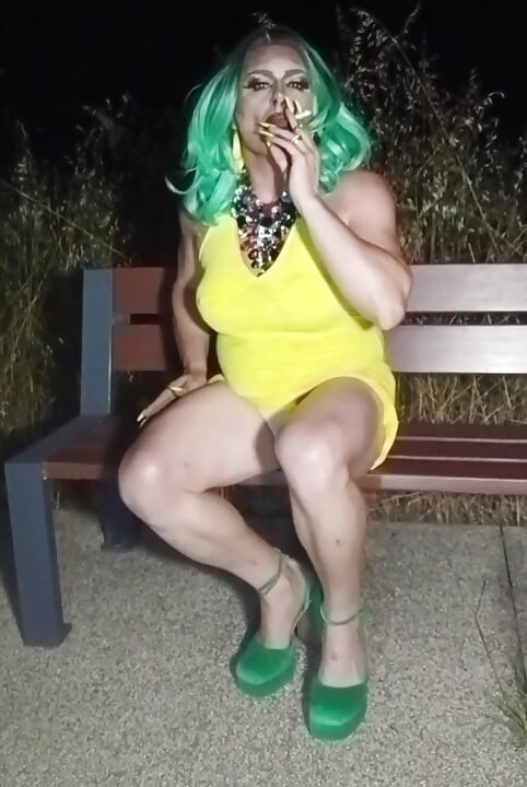 Sexy mature transvestite slut party summer showing off in a public park
