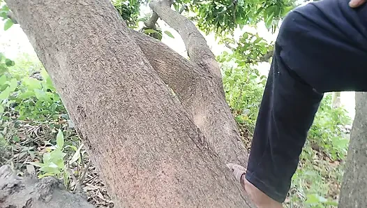 The boy from the local village goes to the garden and climbs on the ground and punches him