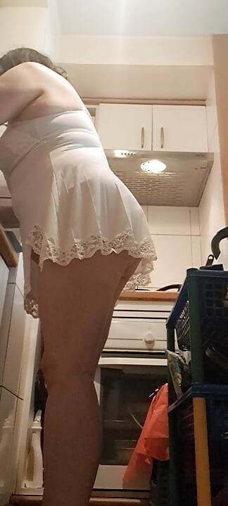 washing dishes without underwear and something small showing her pussy mom in the kitchen