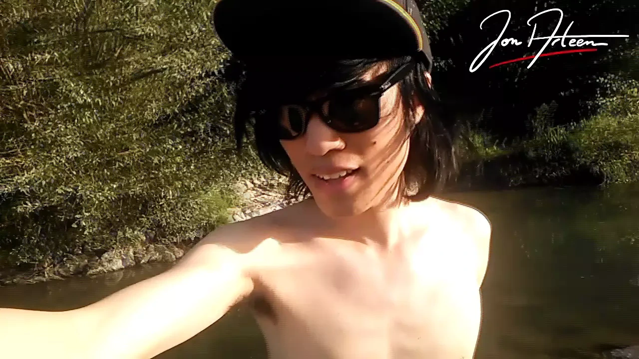 Jon Arteen slim Asian twink boy dancing musical strip-tease on beach smiling showing full pubes outdoor gay porn shoes