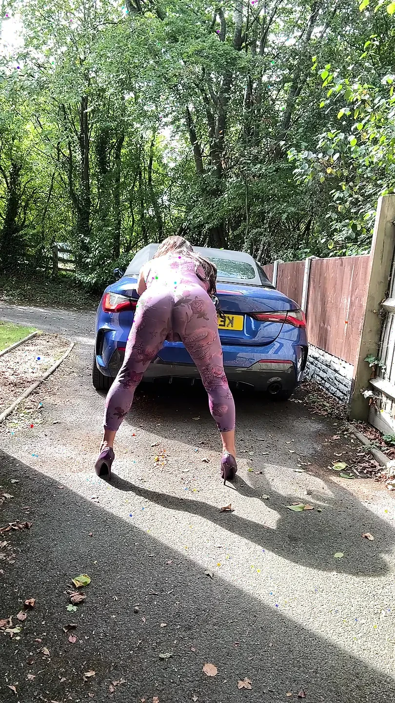 Sexy Crossdresser kellycd2022 in purple catsuit and heels outdoors