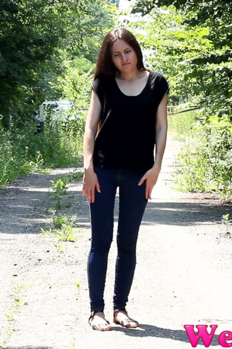 Wide open legs peeing outdoor and Desperate to pee, she has to pee in front of the car in her jeans