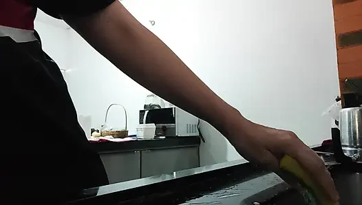 Woman teasing while washing dishes. She loves to transmit to the voyeurs on duty