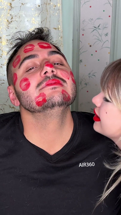 Red Lipstick Kisses Cover His Entire Face