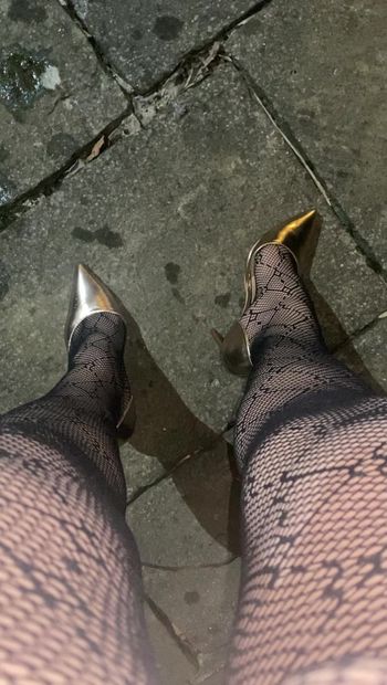 Walking outside in new gold heels and lace tights