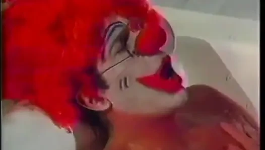 Sexy brunette with a fantastic ass loves doggy style fucking from a clown