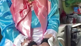 In a blue maid's outfit with pink bows to do the laundry.