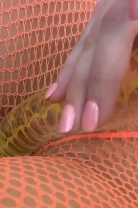 Brunette with sex toy is pleasing her pussy, all in fishnets