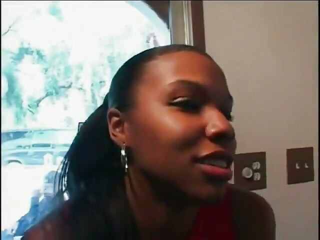 A black girl is on her knees sucking a cock and being fucked