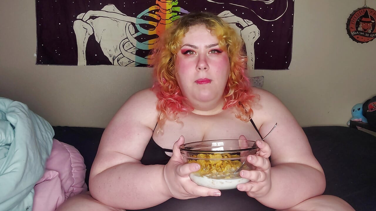 Fat woman eating frosted flakes