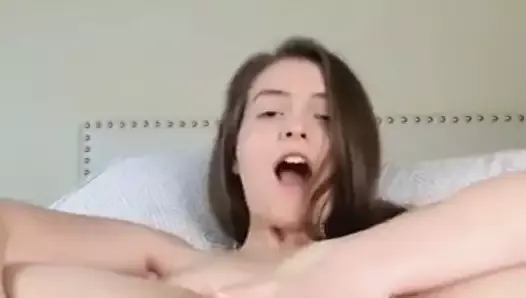 Skinny white girl fingering her ass