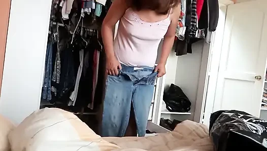 My stepmother tries on jeans while I masturbate, admiring her big ass and hairy pussy.